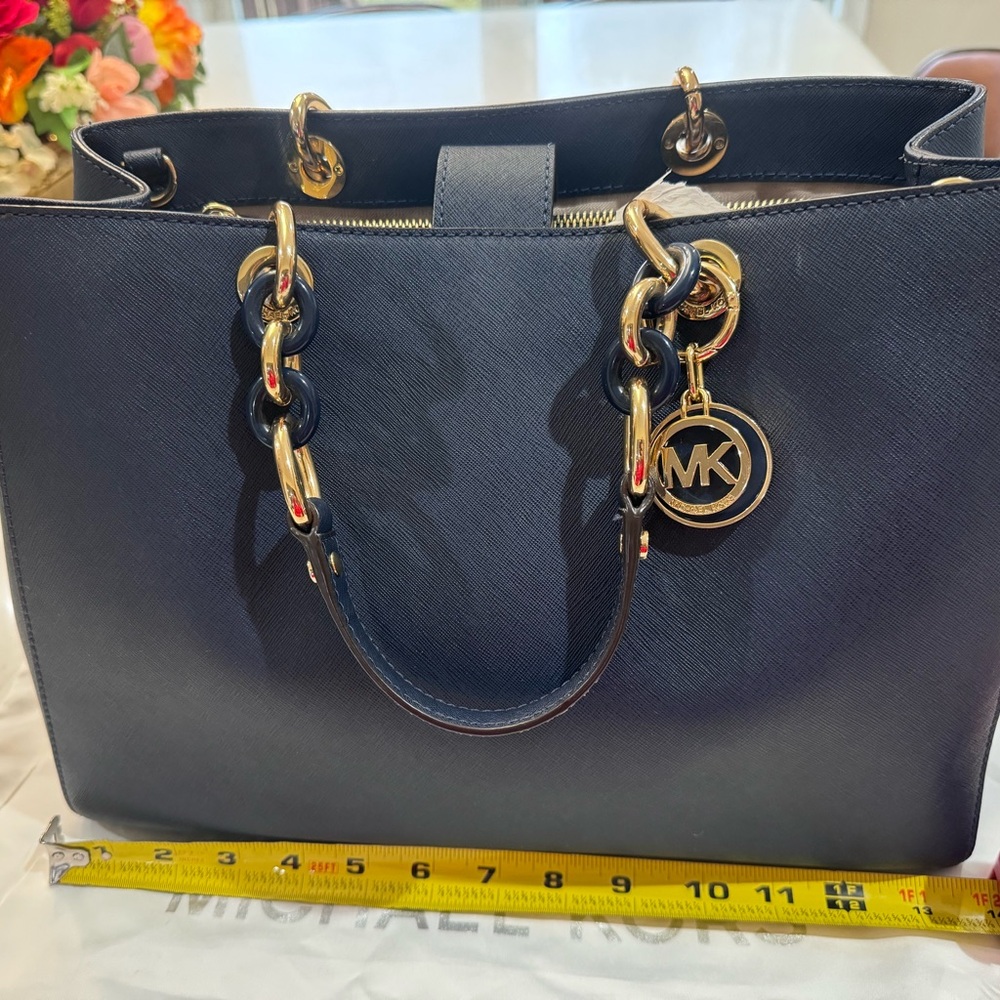 MK tote used once like new comes with crossbody strap navy and gold hardware